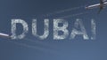 Flying airplanes trails and Dubai caption. Traveling to the United Arab Emirates conceptual 3D rendering