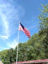 Flying American Flag with blue sky Royalty Free Stock Photo