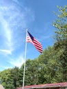 Flying American Flag with blue sky