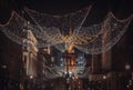 Flying angel Christmas decoration led lights display. Dramatic view of the traditional Christmas decoration lights hanging above