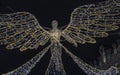 Flying angel Christmas decoration led lights display. Dramatic view of the traditional Christmas decoration lights hanging above