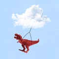 Contemporary art collage of a cloud lifting a dinosaur isolated over blue background Royalty Free Stock Photo