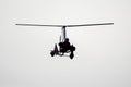 Flying autogyro silhouette on white background Royalty Free Stock Photo