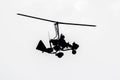 Flying autogyro silhouette on white background Royalty Free Stock Photo
