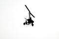 Flying autogyro silhouette on white background Royalty Free Stock Photo