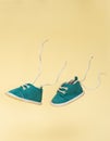 Flying baby shoes with flying laces. Newborn baby concept with levitation effect