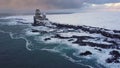 Flying backward at Londrangar cliffs, Snaefellsnes peninsula, Iceland aerial view from drone