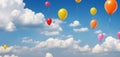 Flying balloons in a blue sky with clouds, A wide banner with copy space area Royalty Free Stock Photo