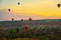 Flying on the balloons early morning in Cappadocia. Colorful sunrise in valley, Goreme village location, Turkey, Asia. Artistic