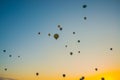 Flying on the balloons early morning in Cappadocia. Colorful sunrise in valley, Goreme village location, Turkey, Asia. Artistic