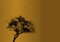 Flying birds flock silhouette and bare leafless tree against ochre / yellowish-orange colour sky illustration. Environment, nature Royalty Free Stock Photo