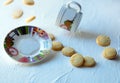 flying biscuits, plate and cup of tea. Falling cookies with mug. Food levitation on white background Royalty Free Stock Photo