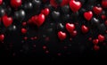 Flying black and red balloons in shape of heart over dark background. Festive heart shaped balloons