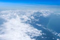 Flying into blue sky and sea of fantasy row clouds and Wing of a Royalty Free Stock Photo