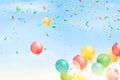 Flying bright Colorful Balloons with confetti, ribbon, serpentine in the blue sky party background. Festive birthday