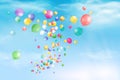 Flying bright Colorful Balloons with confetti, ribbon, serpentine in the blue sky party background. Festive birthday balloons