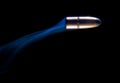 Flying bullet with smoke Royalty Free Stock Photo