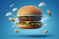 Flying burger on blue background, concept of fast food Royalty Free Stock Photo