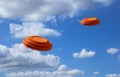 Flying clay disc target shooting on the blue sky , Clay pigeon targets game