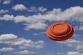 Flying clay pigeon target in the blue sky background , shotgun shooting game