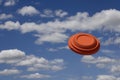 Flying clay pigeon target in the blue sky background , shotgun shooting game