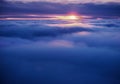 Flying between the cloud at sunset