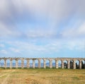 Flying clouds over aqueduct Royalty Free Stock Photo