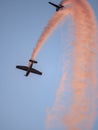 Flying combat aircrafts with yellow traces in the sky