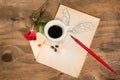 Flying cup of coffee with red rose and playing card. Royalty Free Stock Photo