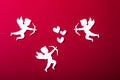 Flying cupid silhouette, happy Valentine`s Day banners, paper art style. Amour on red paper