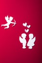 Flying cupid silhouette, two white angel, happy Valentine`s Day banners, paper art style. Amour on red paper