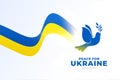 Flying dove bird with ukraine flag trail