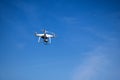 Flying Drone camera or UAV in the blue sky with ocean and island Royalty Free Stock Photo