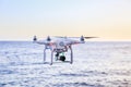 Flying drone at coast above sea Royalty Free Stock Photo