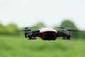 Flying drone at a meadow