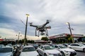 Flying drone over cars in car lot