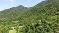 flying drone over green mountains with trees landscape, top view from above, aerial shot, inspirational wonderful nature Royalty Free Stock Photo