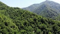 flying drone over green mountains with trees landscape, top view from above, aerial shot, inspirational wonderful nature Royalty Free Stock Photo