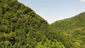 flying drone over green mountains with trees landscape, top view from above, aerial shot, inspirational wonderful nature Royalty Free Stock Photo