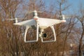 Flying drone quadcopter Dji Phantom 4 with high resolution digital camera. Royalty Free Stock Photo