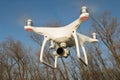 Flying drone quadcopter Dji Phantom 4 with high resolution digital camera. Royalty Free Stock Photo