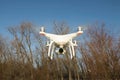 Flying drone quadcopter Dji Phantom 4 with high resolution digital camera. Royalty Free Stock Photo