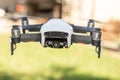 Flying drone with video camera with blurred green background Royalty Free Stock Photo
