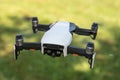 Flying drone with video camera with blurred green background Royalty Free Stock Photo
