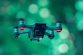 Flying drones on green background blurred