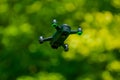 flying drones on green background blurred