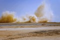 Flying dust after detonator blast in the desert