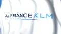 Flying flag with Air France KLM logo, close-up. Editorial 3D rendering