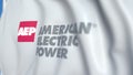 Flying flag with American Electric Power logo, close-up. Editorial 3D rendering