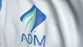 Flying flag with Archer Daniels Midland logo, close-up. Editorial loopable 3D animation